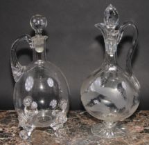 A 19th century ovoid glass decanter and stopper, the scroll feet applied with lion masks, 30cm high;