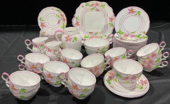 A Gainsborough Adderley Ware tea service for sixteen, decorated with pink flowers, comprising cake