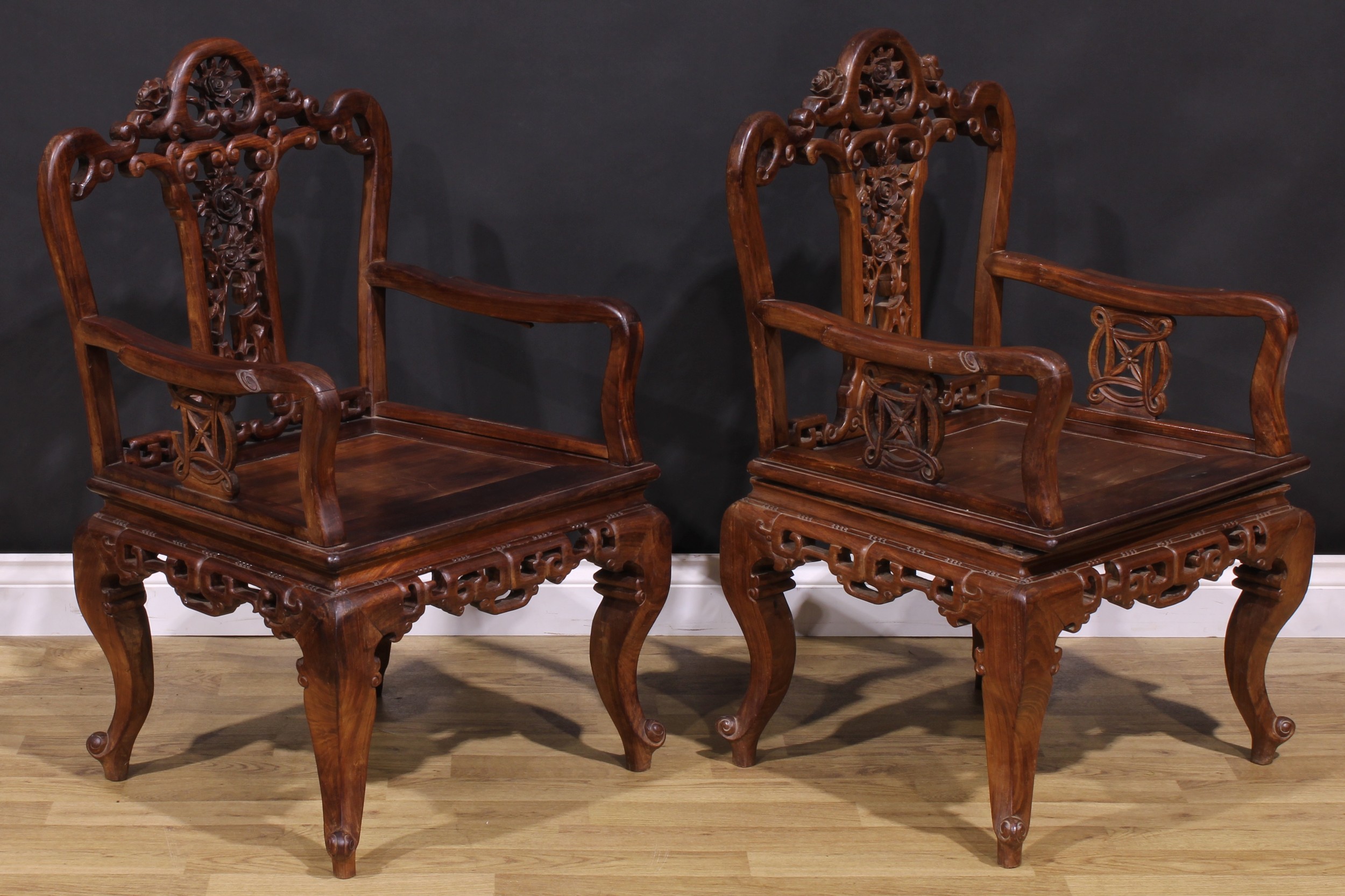 A pair of Chinese hardwood armchairs, each with a shaped back pierced and carved with scrolls and - Image 2 of 4