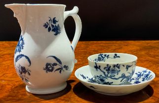 A Worcester Gilliflower pattern jug, decorated in underglaze blue, mask spout, 12.5cm high, crescent