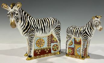 A Royal Crown Derby paperweight, Zebra, gold stopper, 16cm, printed mark; another, Zebra Baby,