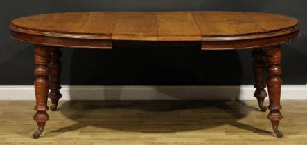 A Victorian oak extending dining table, two additional leaves, turned legs, ceramic casters, 75cm