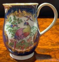 A large Worcester bell shaped mug, painted with fanciful birds within gilt cartouches, the scale