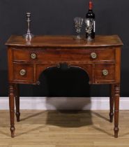 A Post-Regency mahogany bowfront side table, slightly oversailing top above three cockbeaded