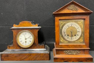 An Edwardian architectural walnut mantel clock, Roman numerals on silvered chapter ring, twin