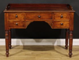A Victorian mahogany kneehole chamber table, rectangular top with shallow three-quarter gallery