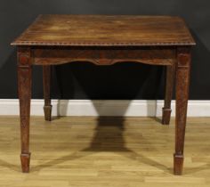An Arts & Crafts period oak table, rectangular top, the underframe carved throughout in the Art