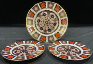 A pair of Royal Crown Derby 1128 Imari pattern tea plates, first quality; a 1128 pattern dessert