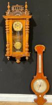 A 19th century mahogany wheel barometer; a Vienna wall clock (2)