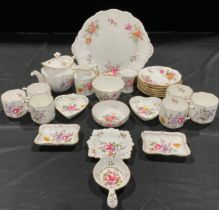 A Royal Crown Derby Posies tea service, comprising a teapot and cover, tea strainer on stand, six