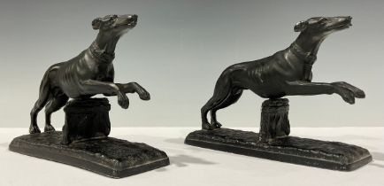 A pair of spelter greyhound or whippet table decorations, 12cm high, 16.5cm long (2)