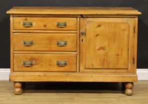 A late Victorian farmhouse pine low dresser, oversailing top above three drawers neighboured by a