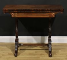 An unusual 19th century rosewood and mahogany card table, hinged top enclosing a baize lined playing