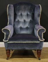 A Victorian wing chair, turned forelegs, ceramic casters, 108cm high, 86cm wide, the seat 53cm