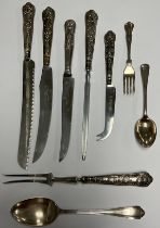 An Elizabeth II silver hafted Queens pattern bread knife, carving knife, knife sharpener and