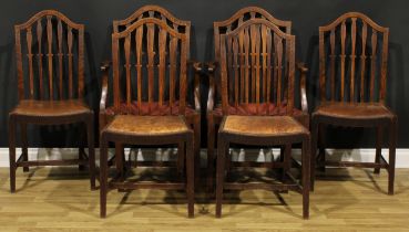 A set of six early 20th century oak dining chairs, comprising four side chairs and a pair of