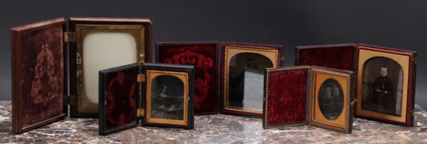 Photography - a 19th century ambrotype photograph, of a young lady holding a book, the union case