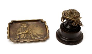 A Japanese brass ring tray, amusingly embossed with a monkey wearing spectacles, 8cm wide, early