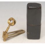 A 19th century brass pocket field microscope, folding for travel, 6.5cm long, cased