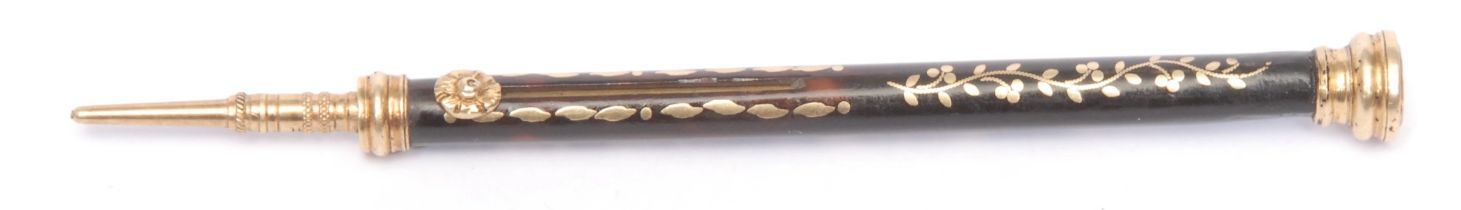A 19th century tortoiseshell and gold coloured metal pique propelling pencil, the terminal set
