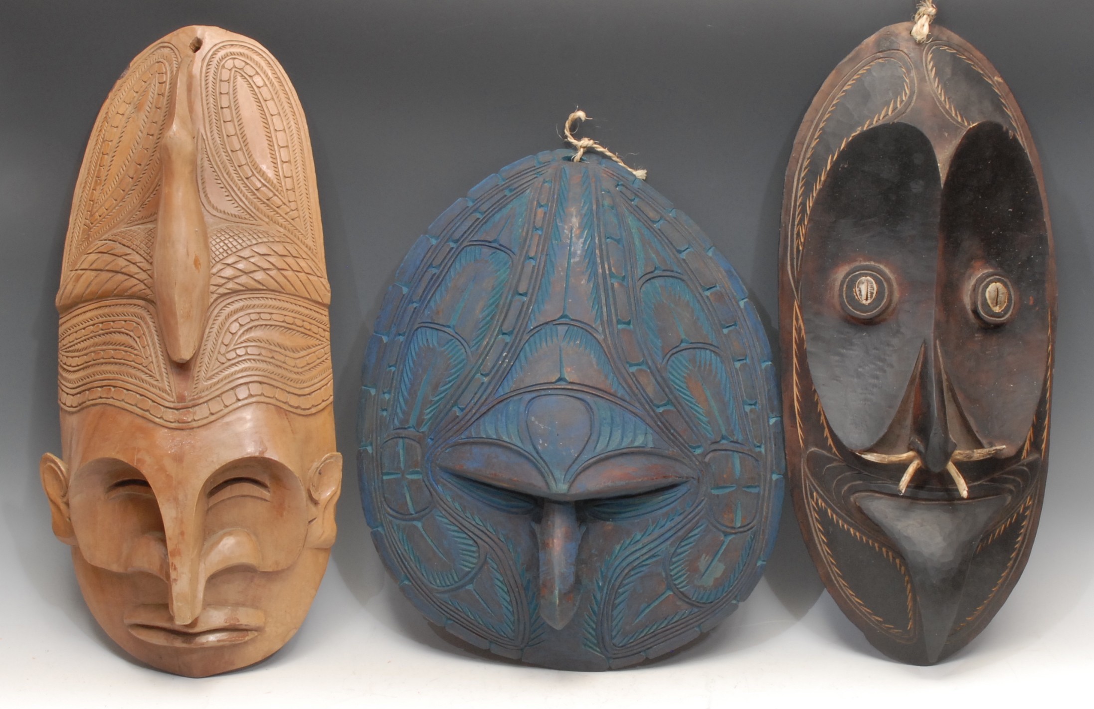 Tribal Art and the Eclectic Interior - a Papua New Guinea mask, stylised concave features,