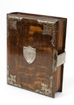 A late Victorian oak novelty tobacco cabinet, as a book, hinged cover enclosing lidded compartment