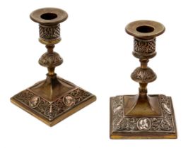 A pair of 19th century electrotype candlesticks, in the Renaissance Revival taste, applied with