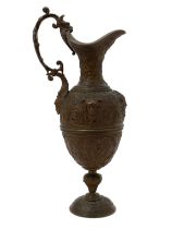 A 19th century Renaissance Revival bronze pedestal ewer, in the Cellini taste, cast with masks,