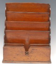 A 19th century mahogany desk top letter rack, tiered and projecting stationery divisions, 30cm high