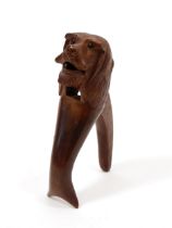 Nutcrackers - a Black Forest lever-action novelty nut cracker, carved as the head of a dog, 16.5cm