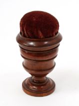 Treen - a 19th century turned mahogany campana shaped sewing companion, the push-fitting cover