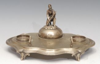 Military Interest - a late Victorian EPNS desk stand, surmounted by a figure of a soldier, 25cm wide