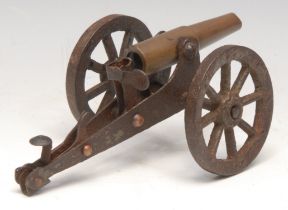 An early 20th century trench art model cannon, the barrel formed from a brass bullet casing, 13.