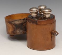 A set of three Edwardian silver mounted glass cologne bottles, leather cylindrical case, 14.5cm