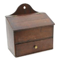 A George III mahogany candle or salt box, hinged sloping cover, drawer to base, 28cm wide, early