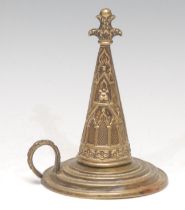 An early Victorian Gothic Revival brass candle snuffer and stand, embossed with tracery and