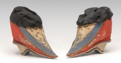 A pair of 19th century Chinese children's silk lotus shoes, embroidered with silk butterflies and