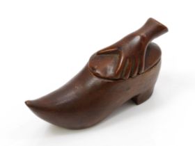 A 19th century novelty snuff box, as a shoe, the cover carved with a grasping hand, 10cm long