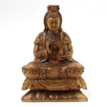 A Chinese hardwood carving, of Bodhisattva Guanyin, seated in a lotus and holding a bottle, 31cm