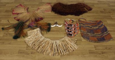 Tribal Art and the Eclectic Interior - a Papua ew Guinea grass skirt; others; a textile bag,