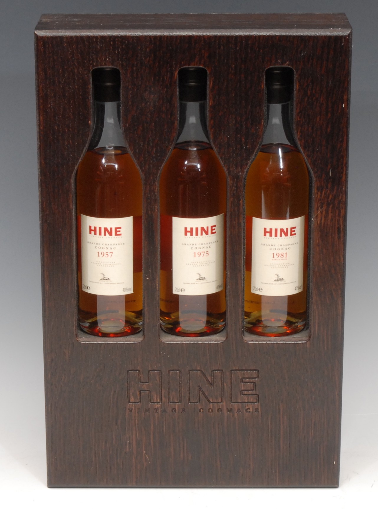 A presentation set of three 20cl bottles, Hine Grand Champagne Cognac, 1957, 1975 and 1981, wooden