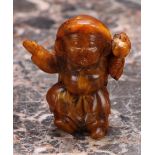 A Japanese amber netsuke, carved as a young boy, 5cm long