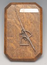 An early 20th century silver and oak canted rectangular novelty letter clip, of equestrian