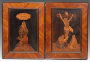 A pair of Italian walnut and marquetry rectangular panels, inlaid with The Crucifixion and The