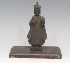 A cast metal ecclesiastical figure, The Infant Jesus Of Prague, wooden base, 13cm high