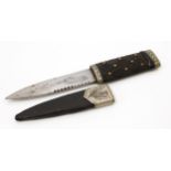 A Scottish sgian dubh dagger, 11cm blade with serrated spine, ebony faux-woven hilt, bright-cut