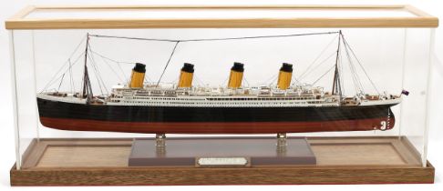 A maritime model ship, RMS Titanic, 1/350th scale, hand painted, cased, 83cm wide overall