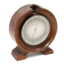 An early 20th century lacquered brass aneroid barometer, 11cm silvered register inscribed T Wheeler,