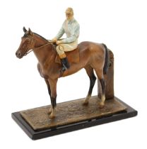 An Art Deco style cold painted novelty table lighter, as a horse and jockey, 17.5cm wide