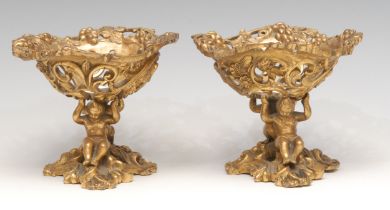 A pair of 19th century ormolu sculptural sweetmeat stands, cast in the Baroque taste with scantily